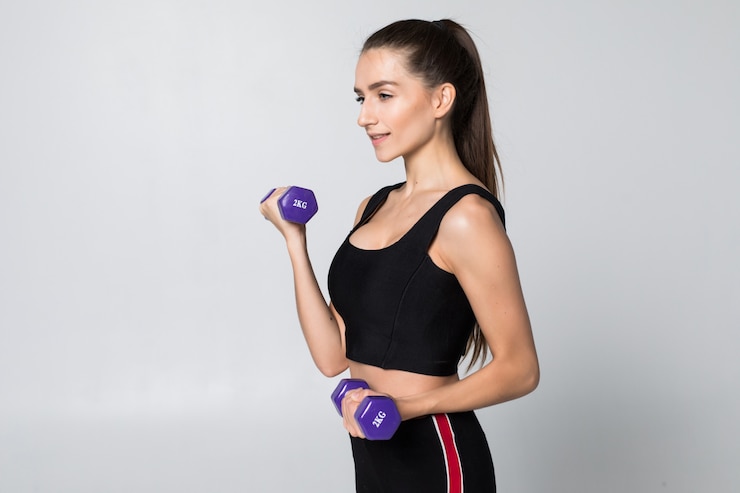 fitness-woman-with-dumbbell-isolated-white-wall_231208-1035